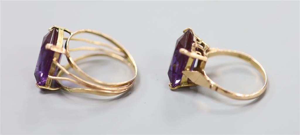 Two 20th century Middle Eastern yellow metal and gem set dress rings, gross 7.6 grams.